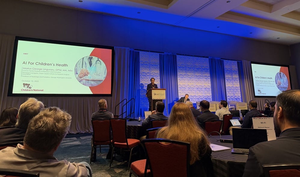 Marius Linguraru, DPhil, MA, MSc, gives a presentation about AI in children's health