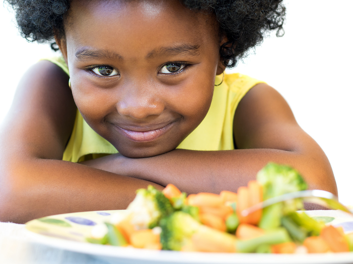 girl with a plate of food