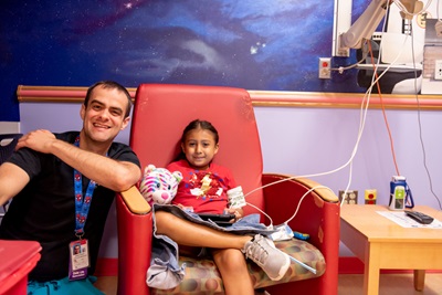 Child life specialist and young patient