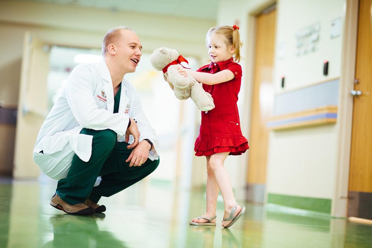 doctor with female patient and bear