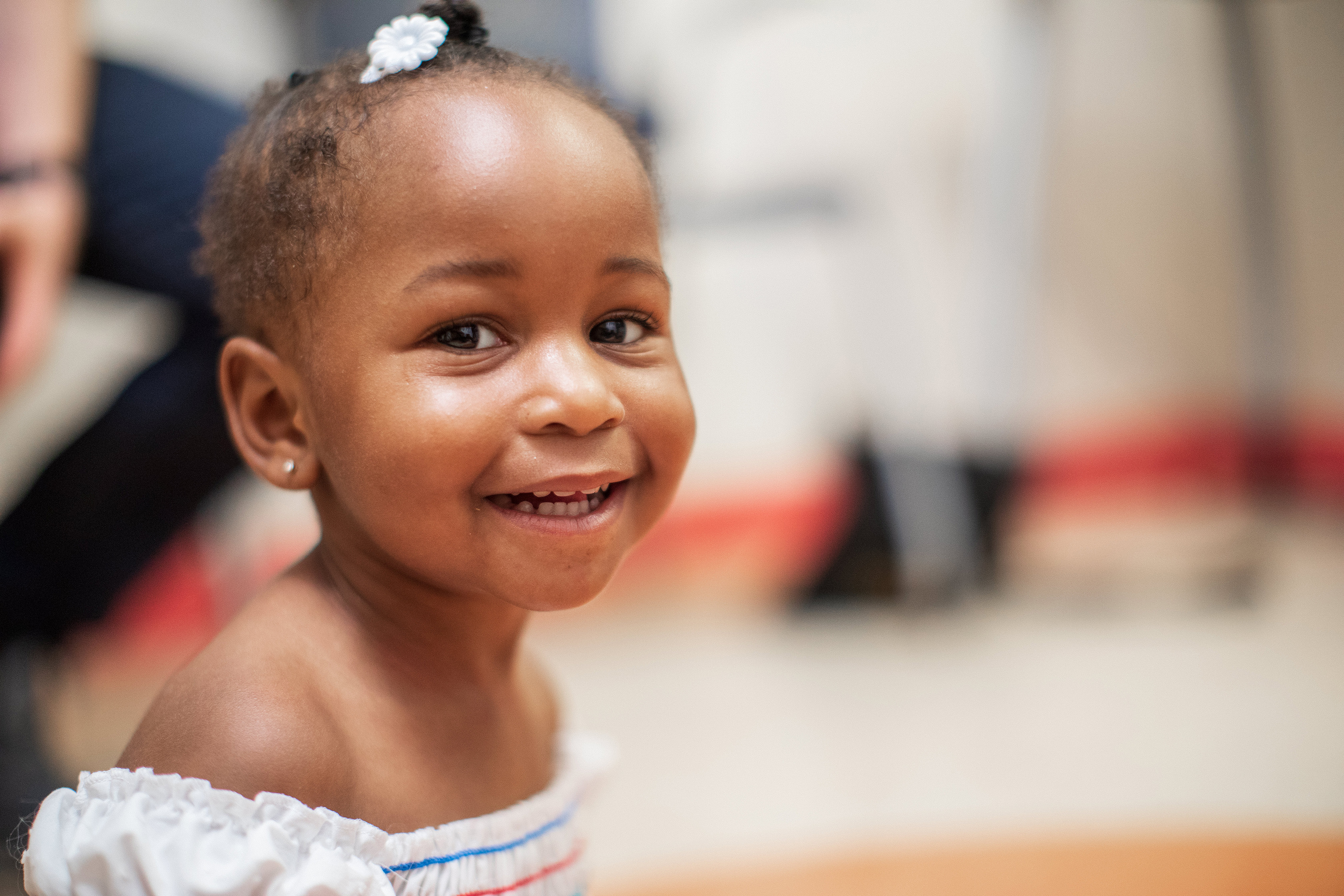 little girl smiling in exam room