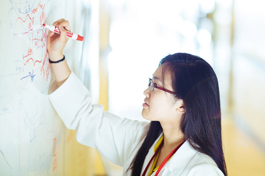 physician writing on white board