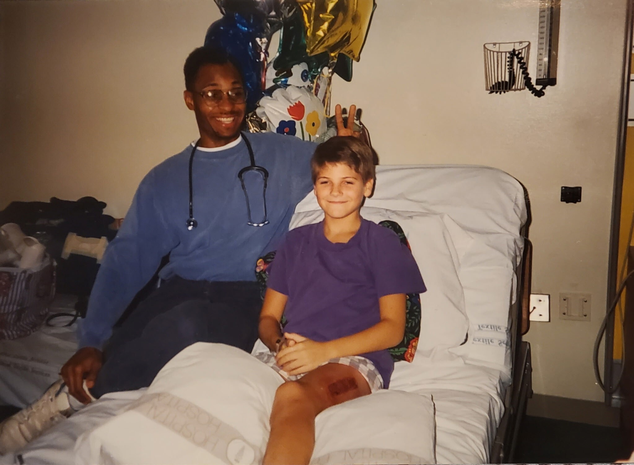 Nurse Calvin Burke with a patient