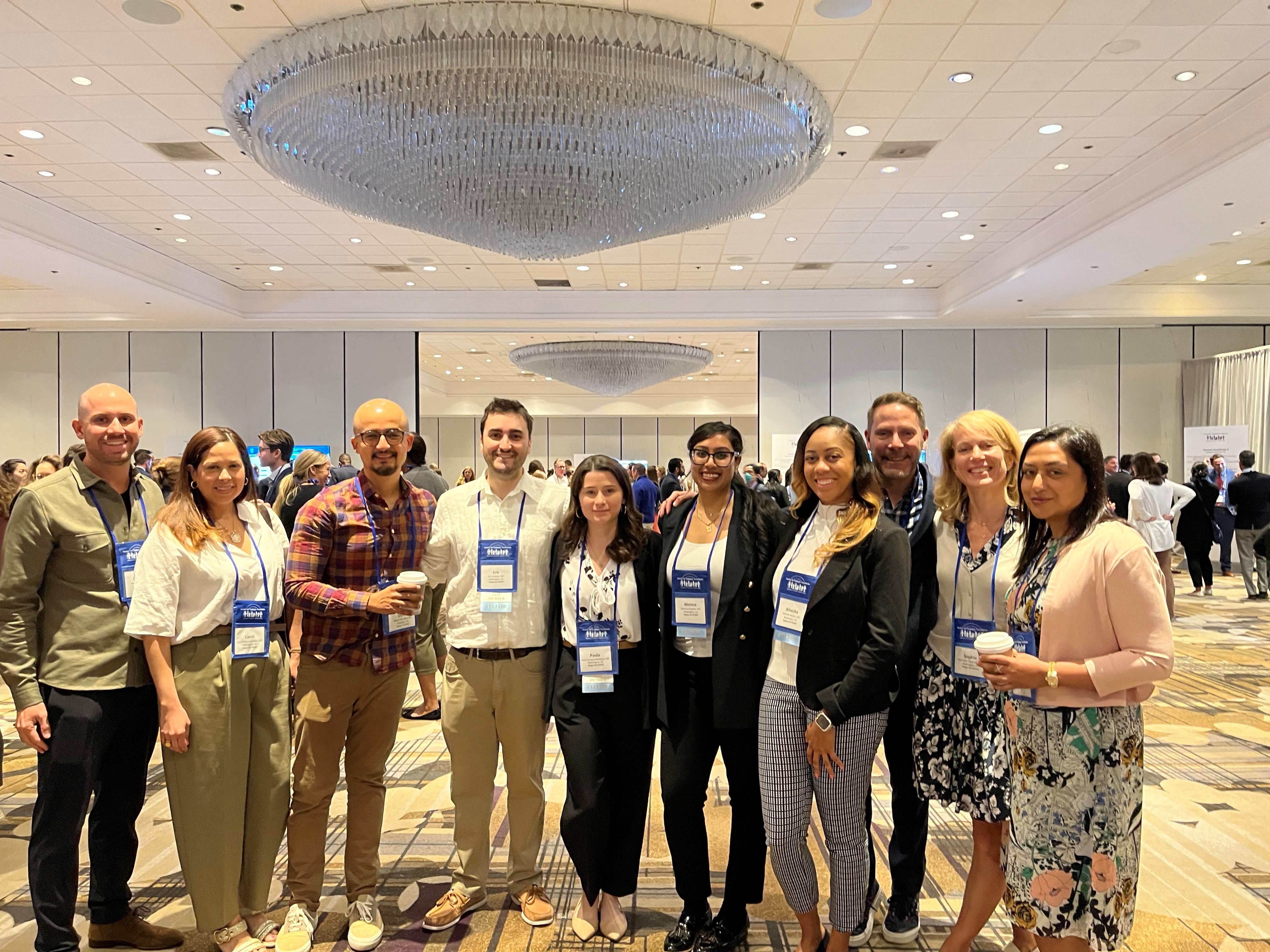 Fellows pose at a conference.