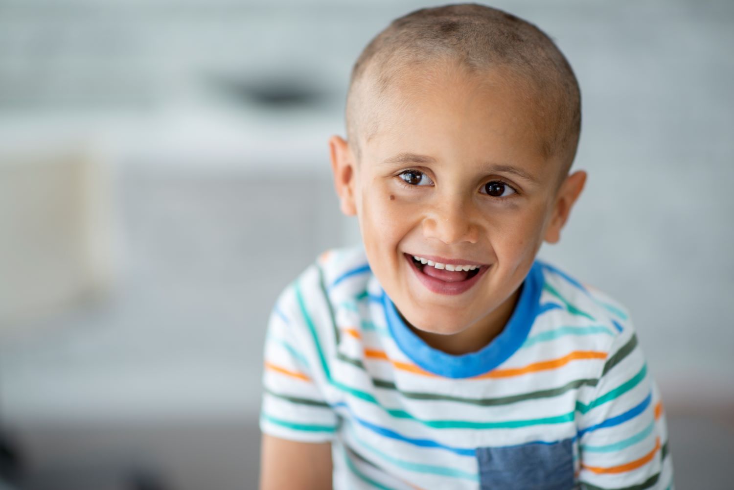 smiling young boy with cancer