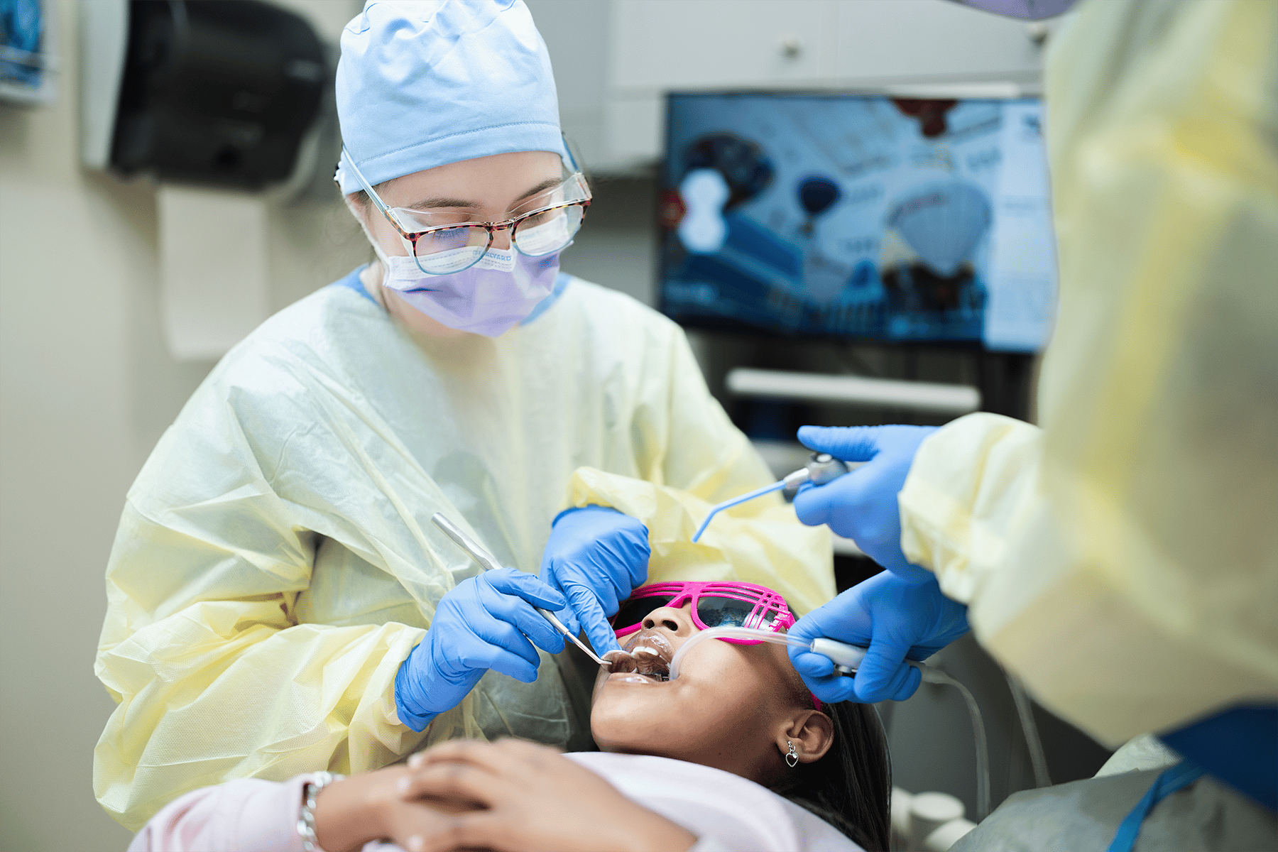 Dentist cleaning a patients teeth