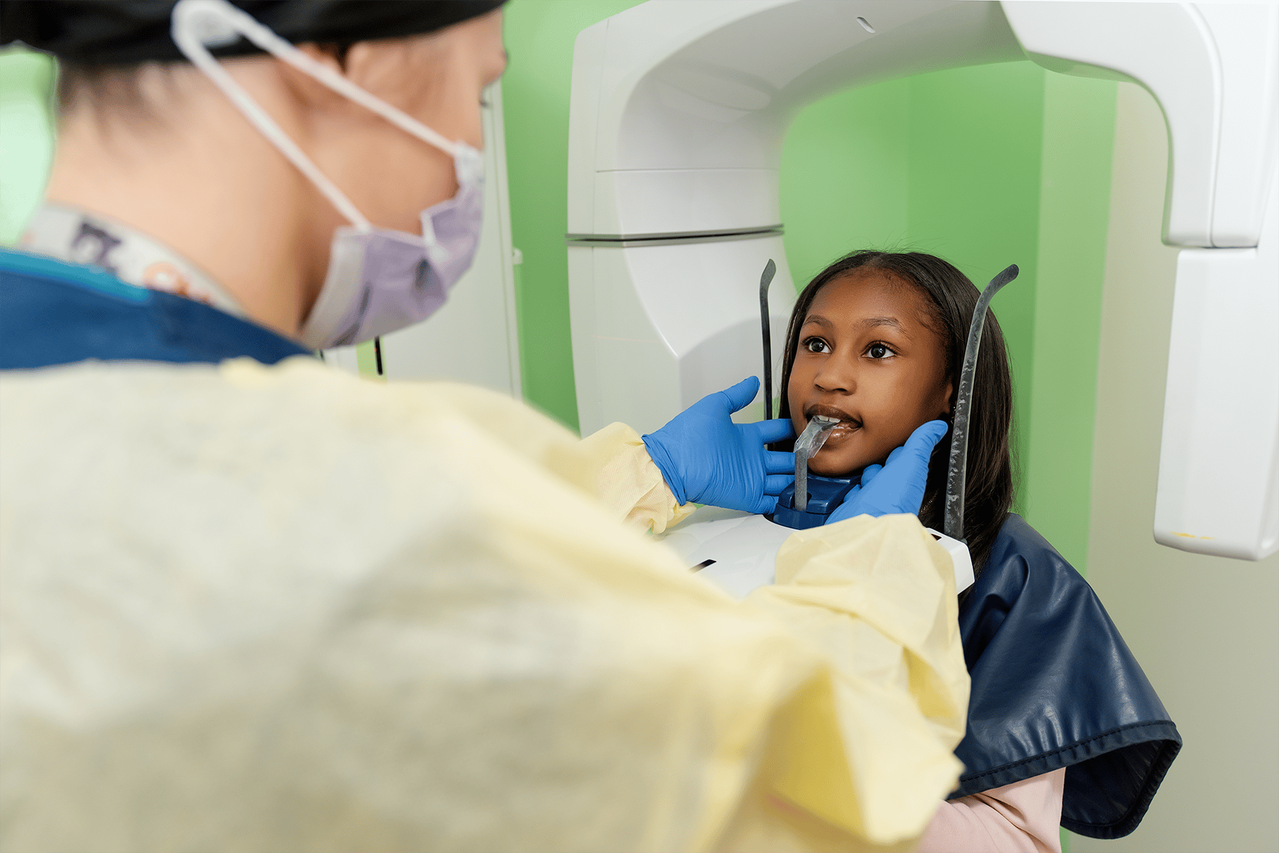 Pre-teen patient getting an x-ray