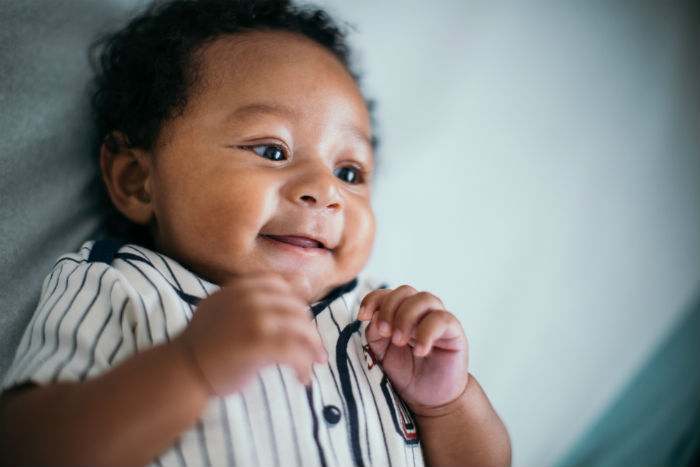 Infant boy smiling 