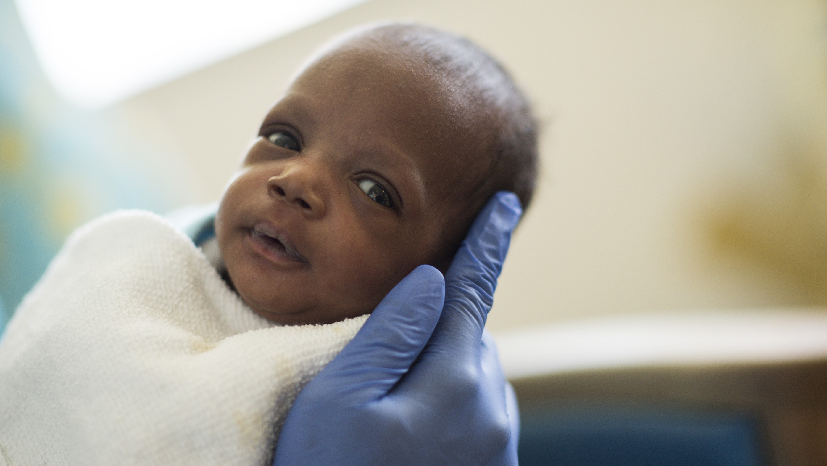 Baby being held in NICU NICU baby