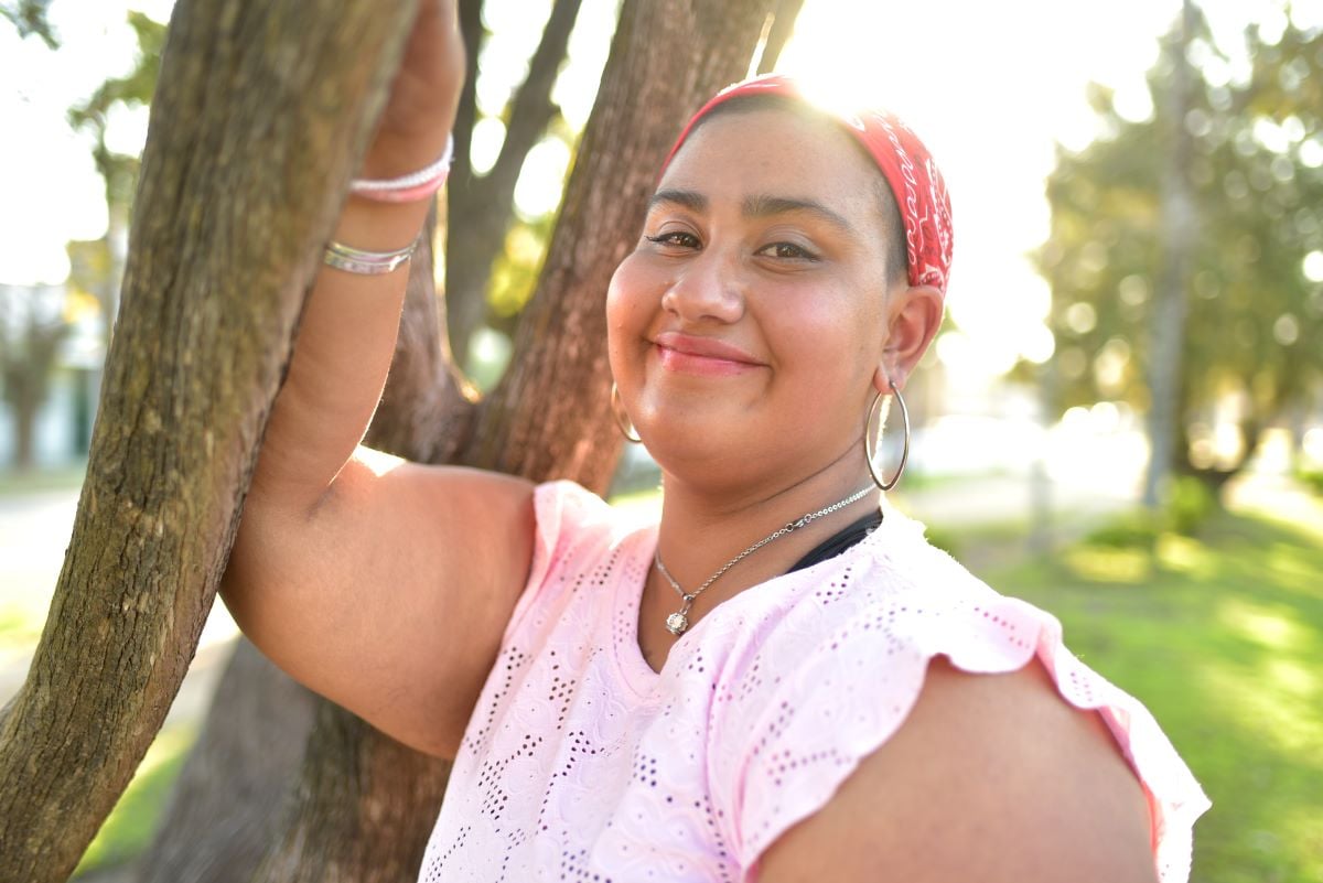 teen girl smiling in the park
