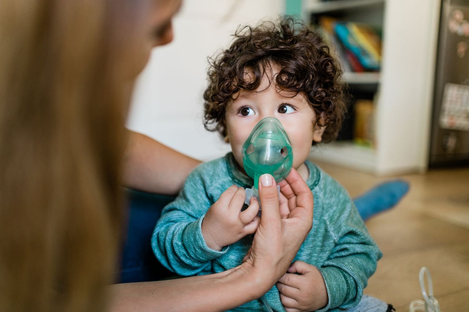 toddler boy using nebulizer treatment