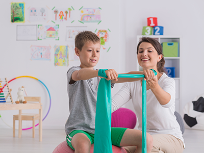 little boy doing physical therapy