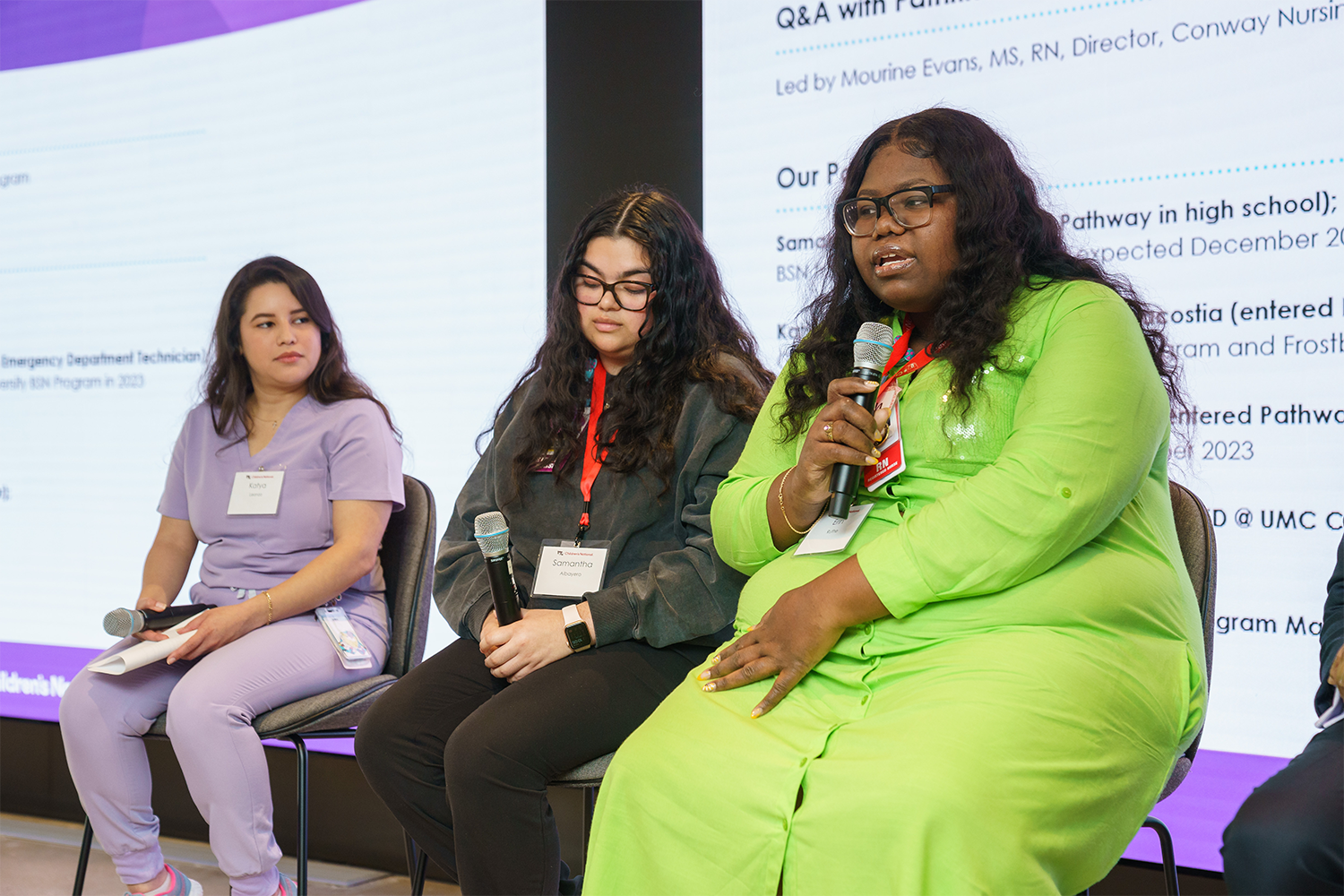 Women on stage presenting