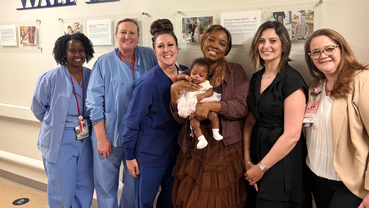 healthcare providers and baby Akosua with mother