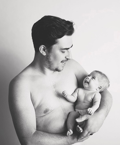 Infant Winona being held by dad