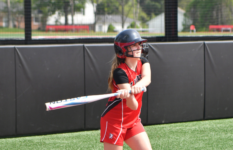 Alicia playing baseball