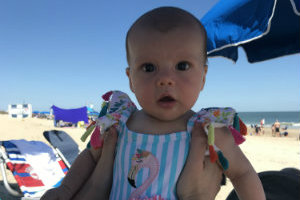 Children's National patient, Sadie, as an infant at the beach.