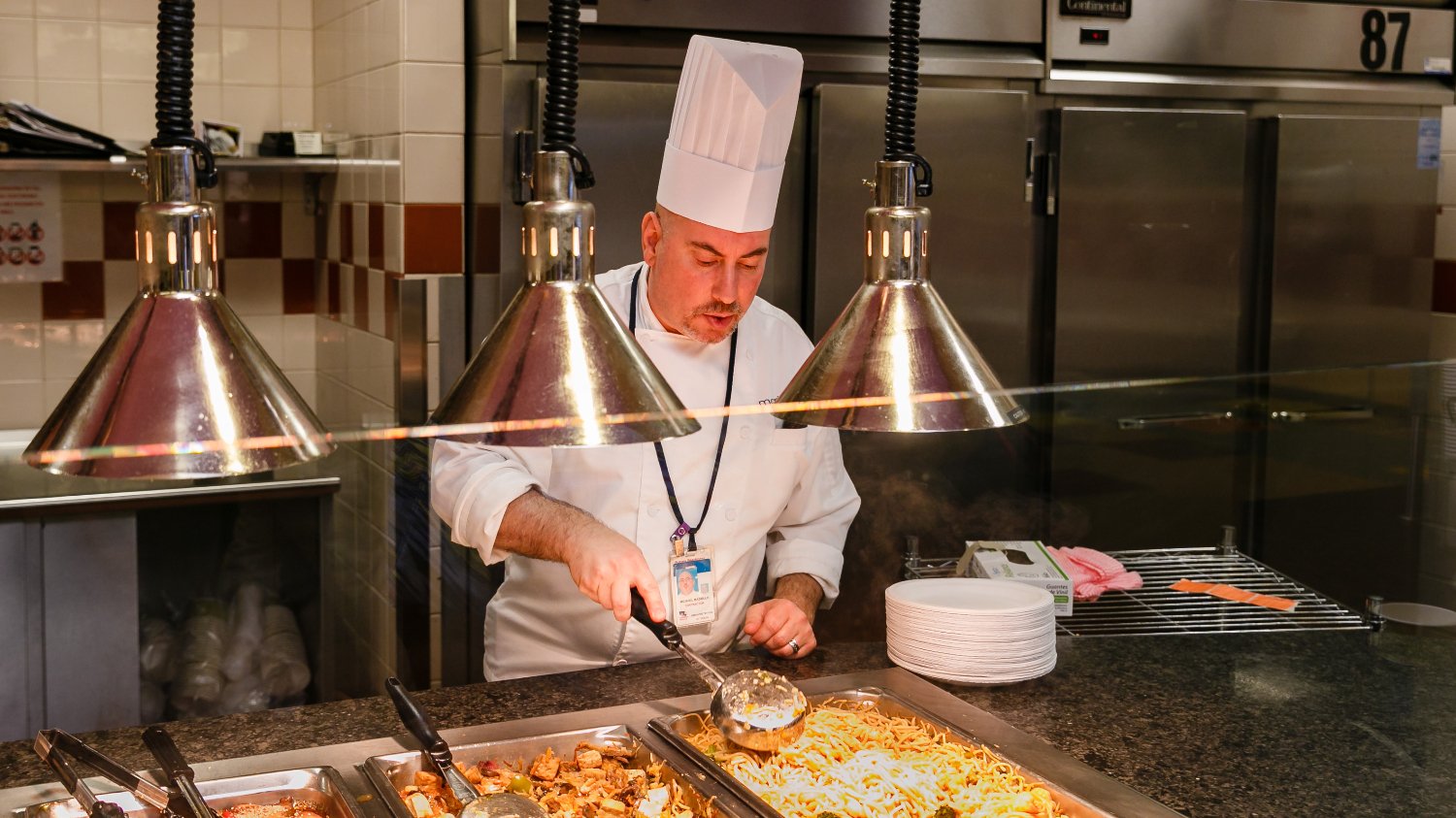 Chef Mike prepares to serve food to families at Children's National Hospital.
