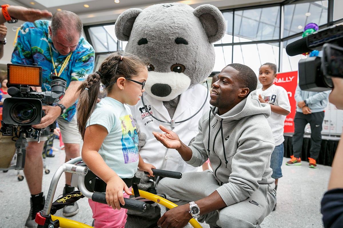 Kevin Hart and young girl with Dr. Bear