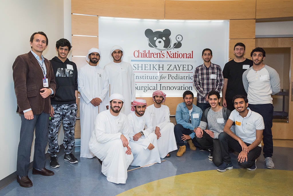 students and provider group photo in front of Children's Sign