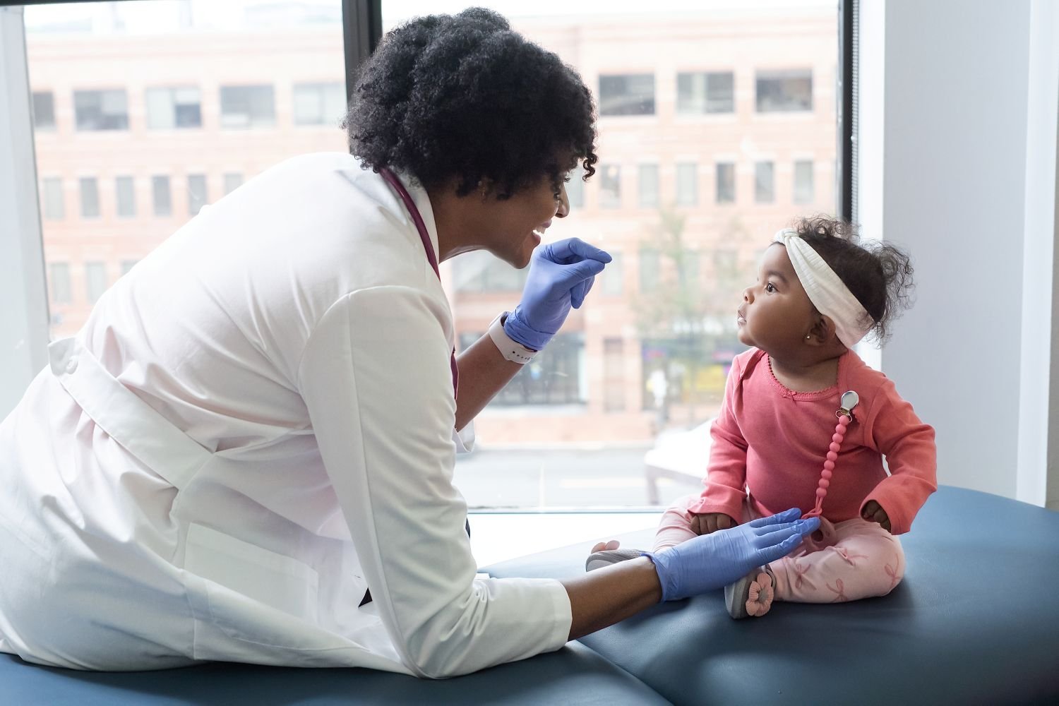 Provider examining baby