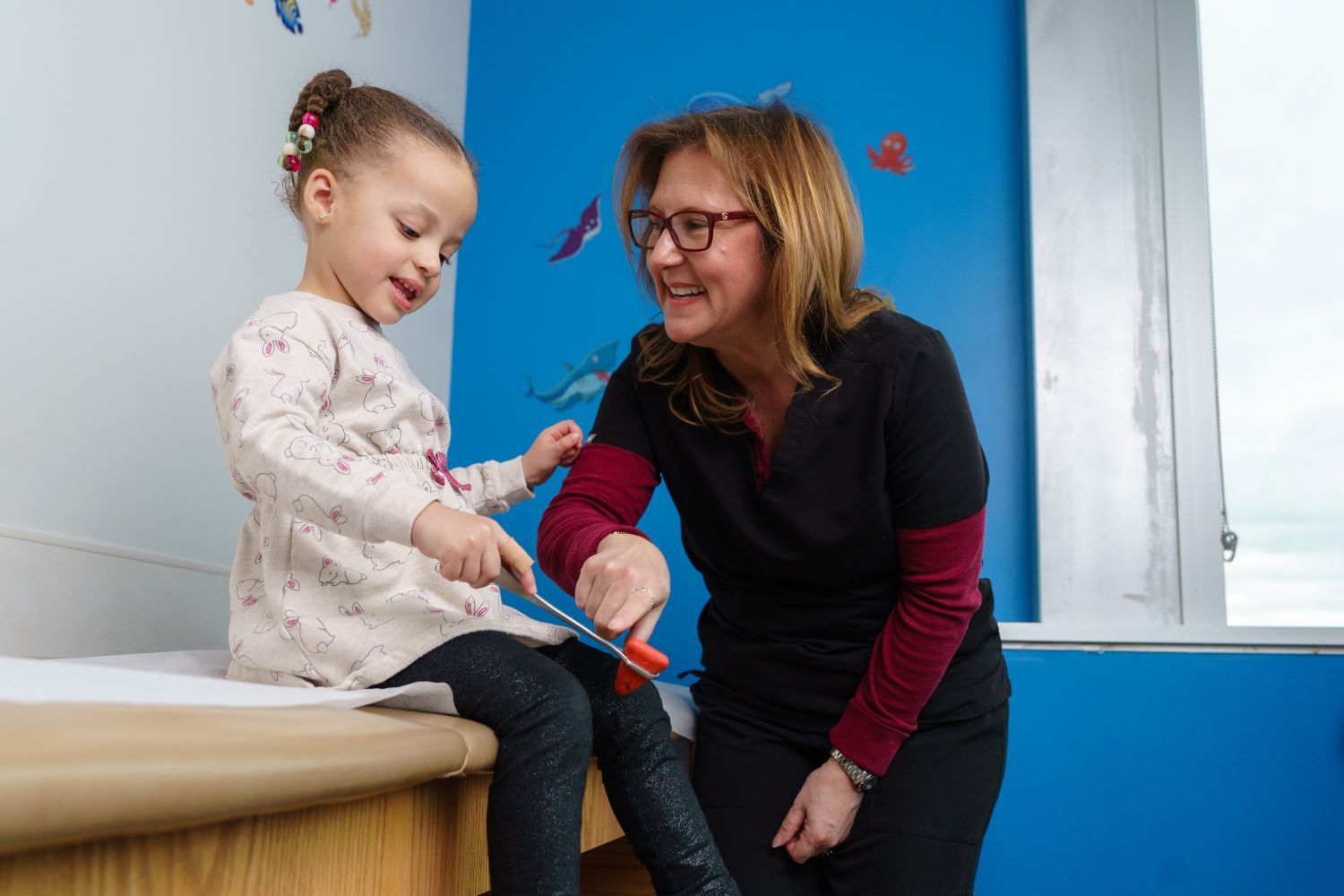 doctor and patient check reflexes