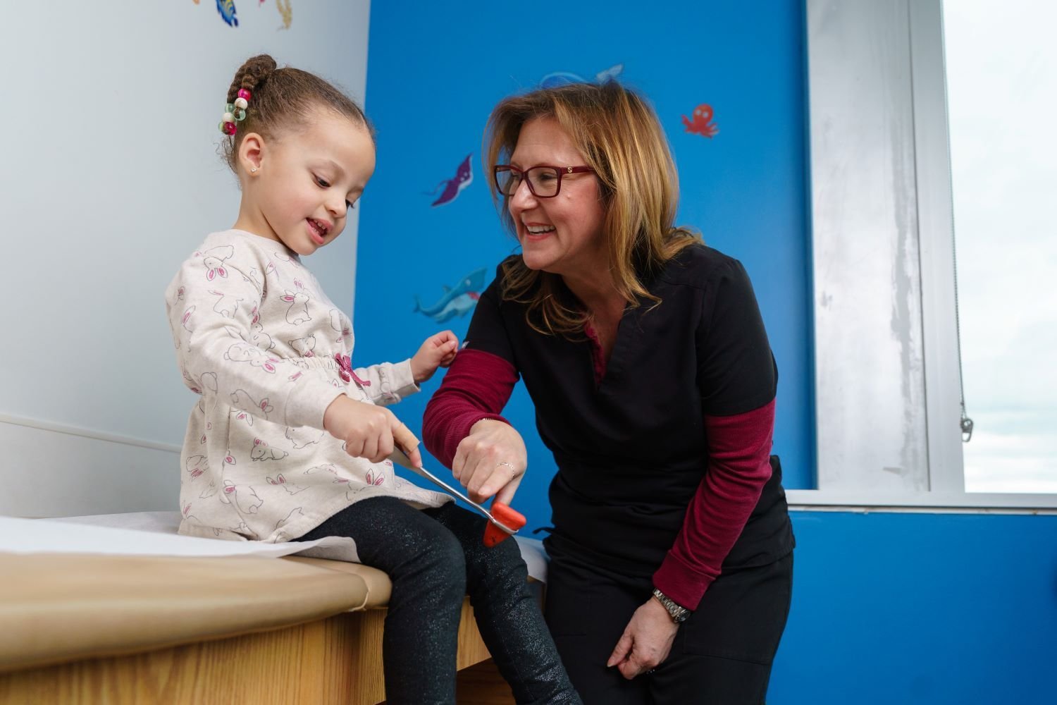 doctor and patient check reflexes