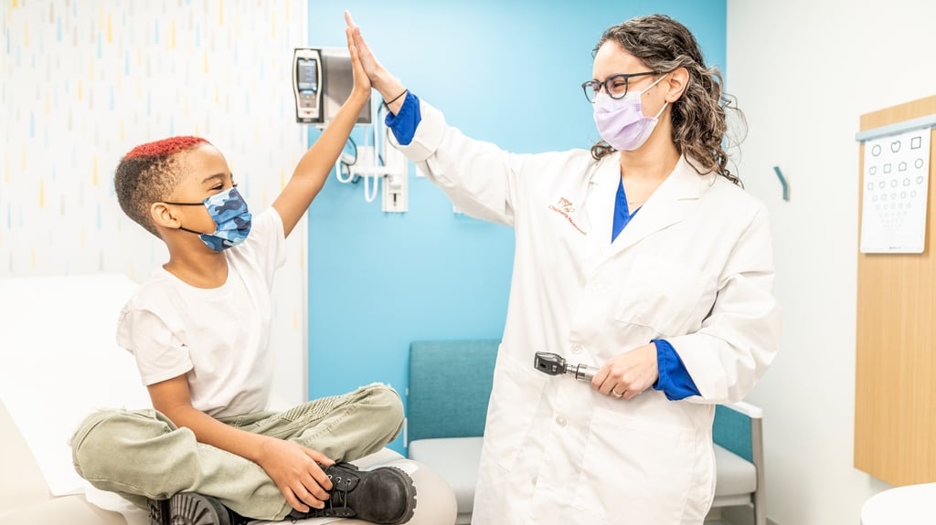 doctor high fives patient