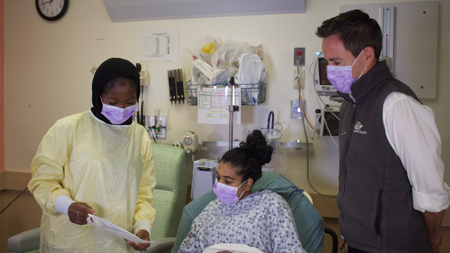 Caleb Ward, MD, and an ED Research intern consenting a patient for study enrollment
