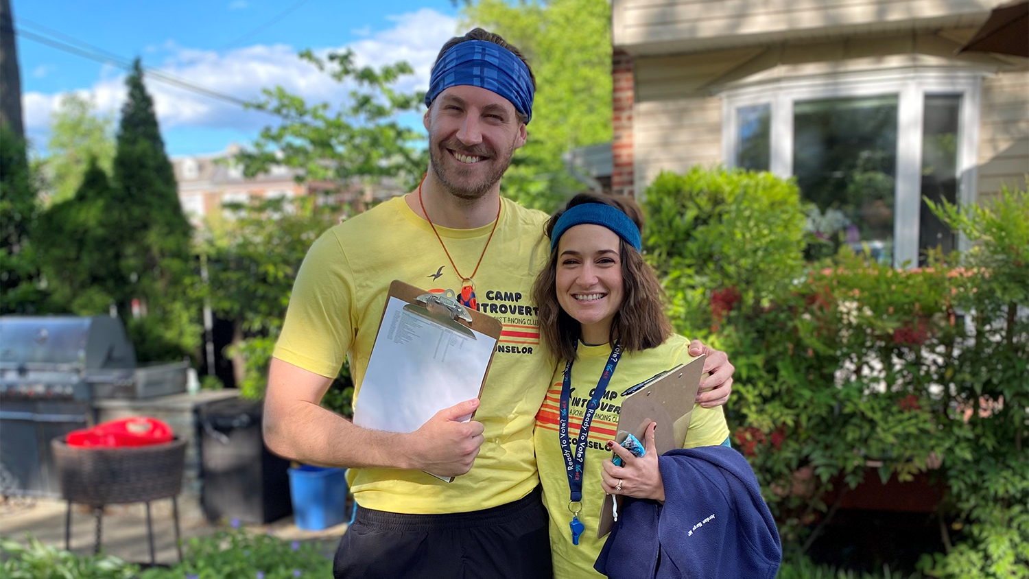 Man and woman standing outside smiling