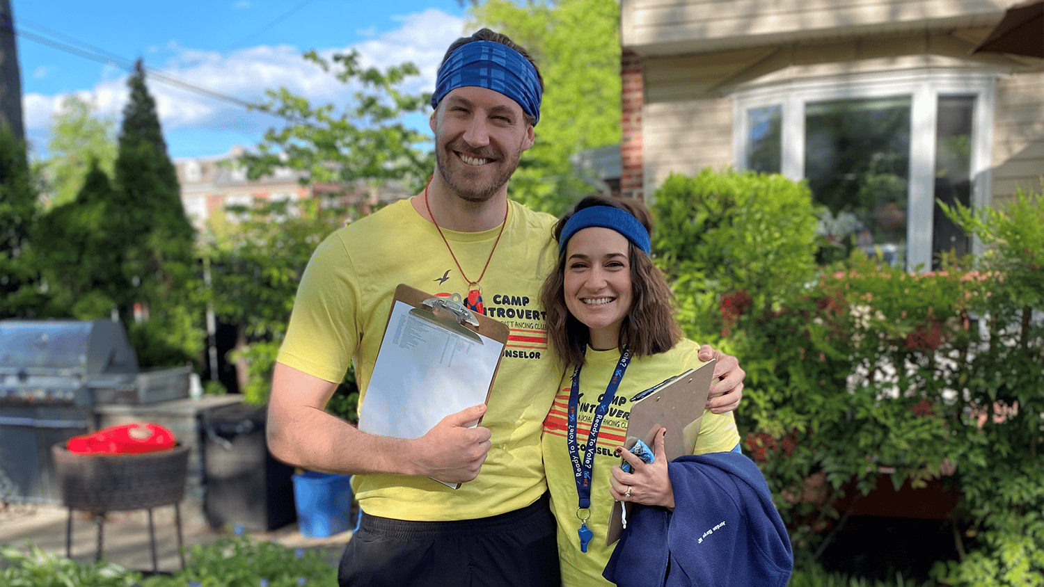 Man and woman standing outside smiling