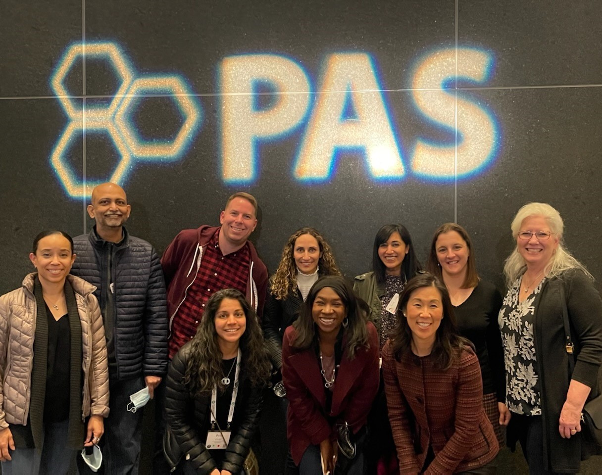 Group photo in front of the PAS conference sign