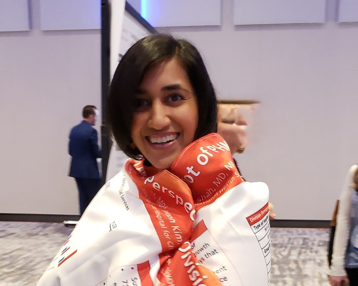 Woman smiling wrapped in a blanket