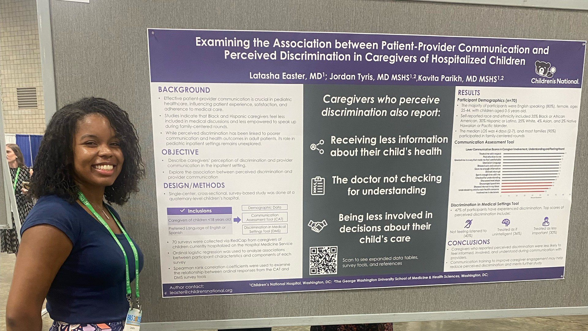 Fellow standing beside their research poster