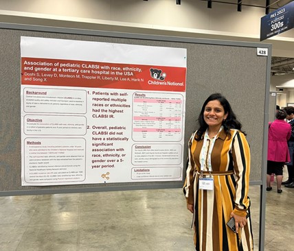 An Infectious Disease traditional track fellow with her poster presentation at Children's National.