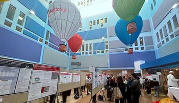 REI Week 2025 posters in the Costco Wholesale Atrium.