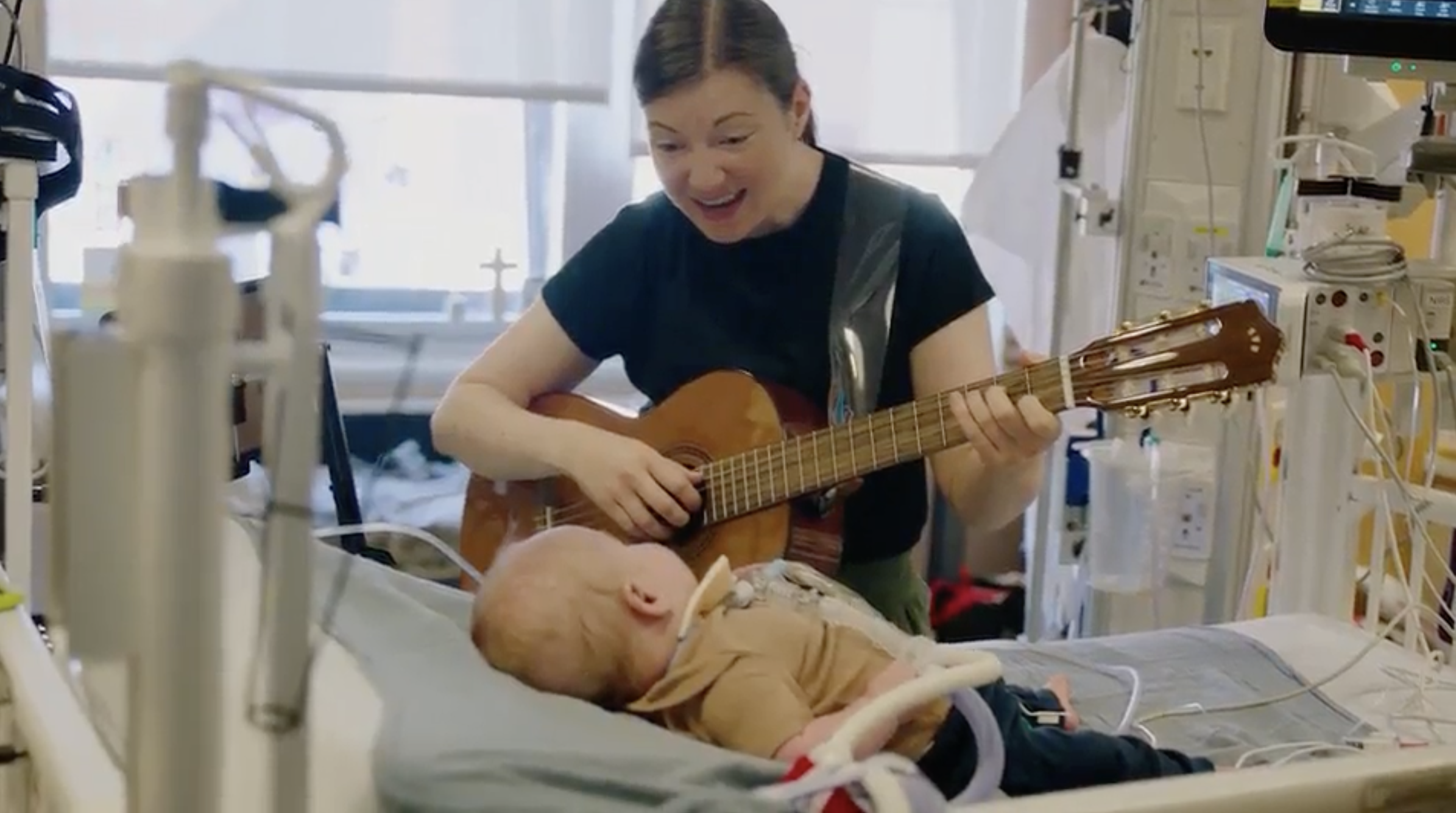 Singing and playing to a young patient