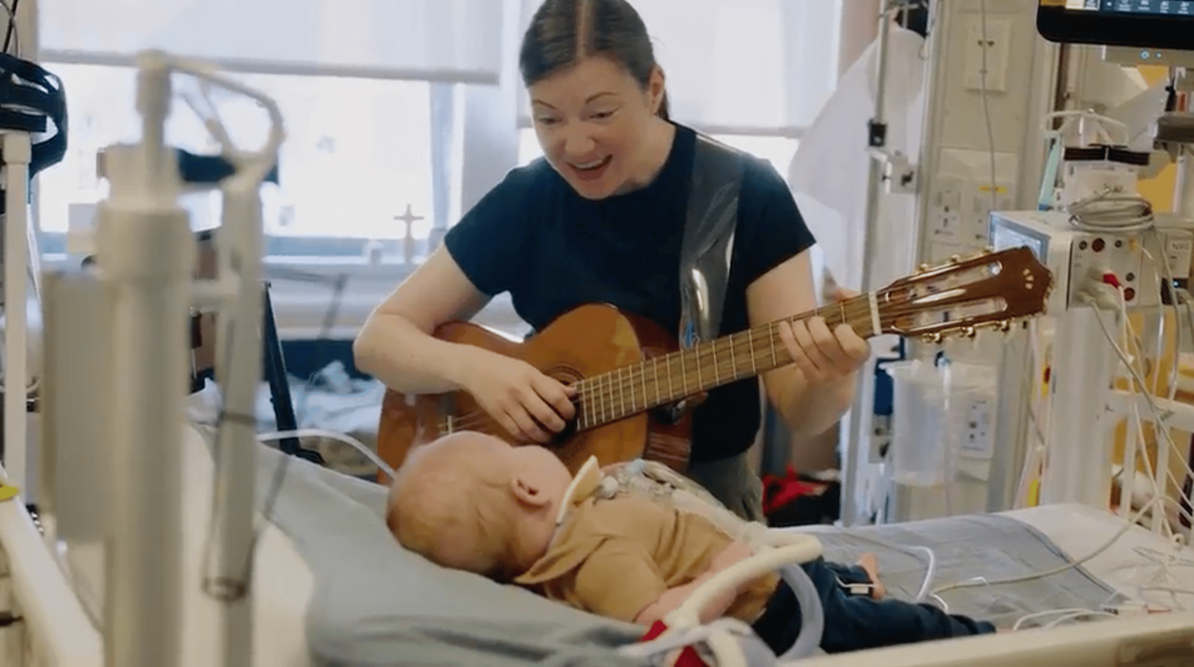 Singing and playing to a young patient