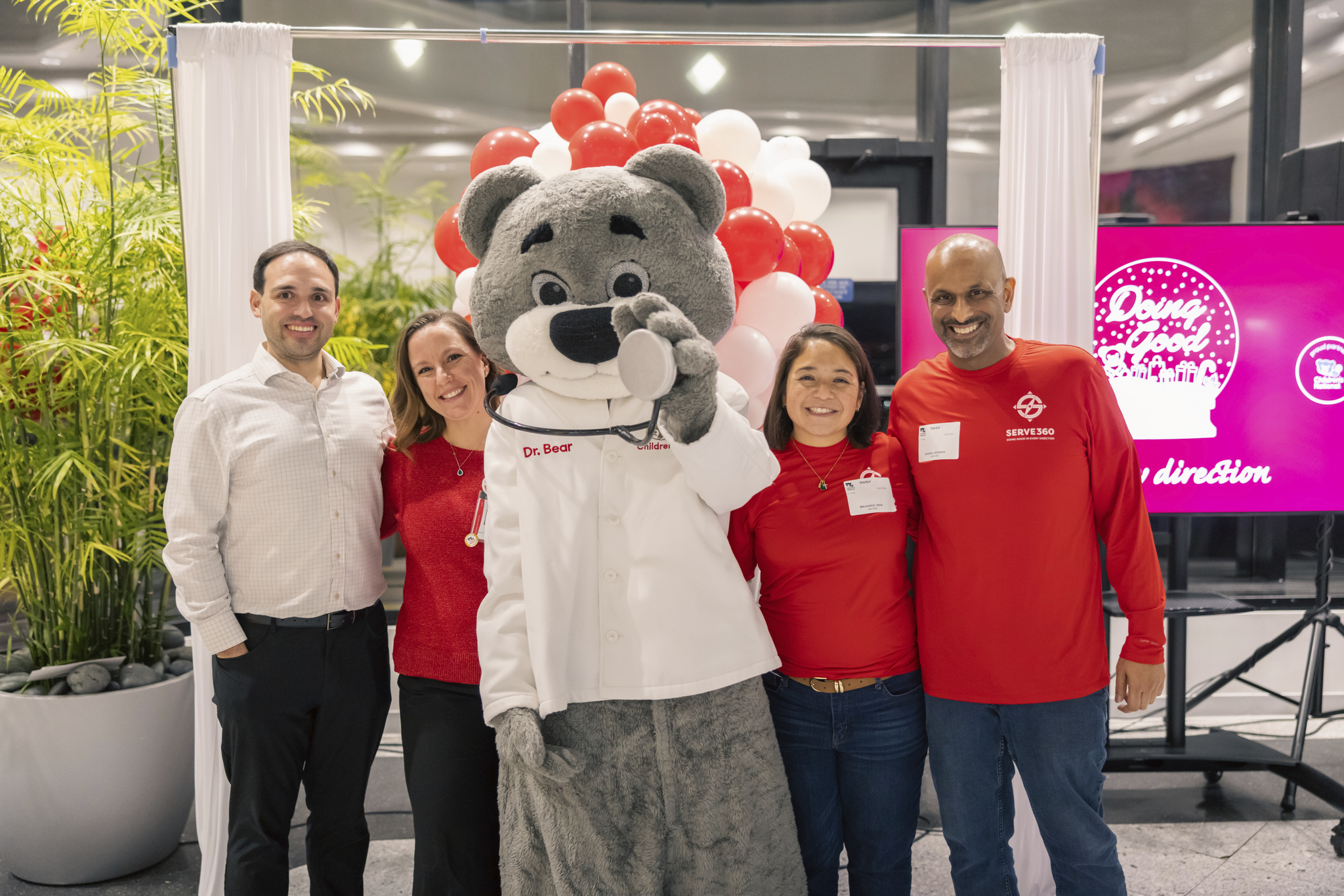 Dr. Bear poses with Children's National Hospital and Marriott International representatives at a joint philanthropic event.