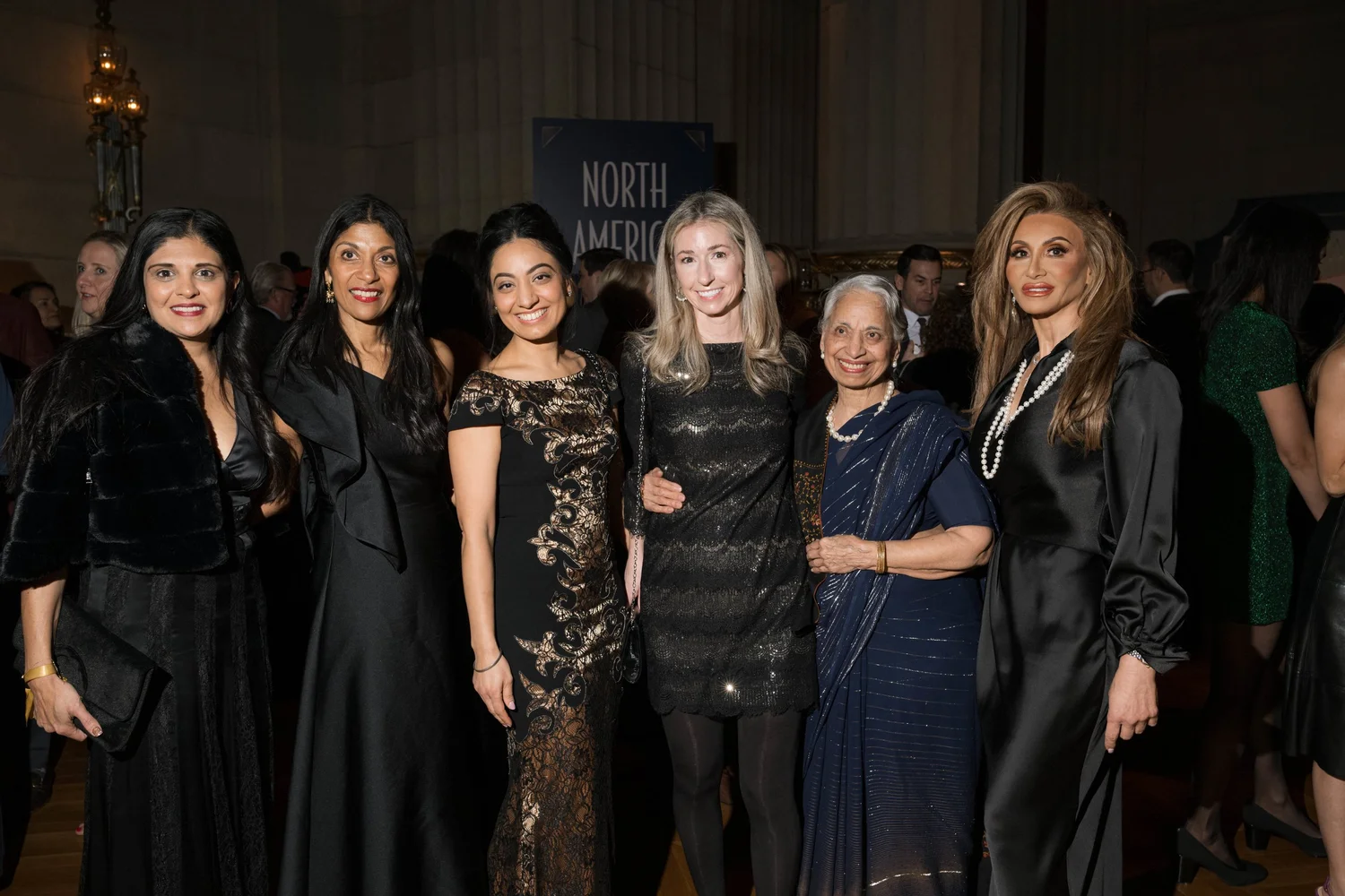 A group of A Vintage Affair 2025 event attendees smiling and posing for a photo.