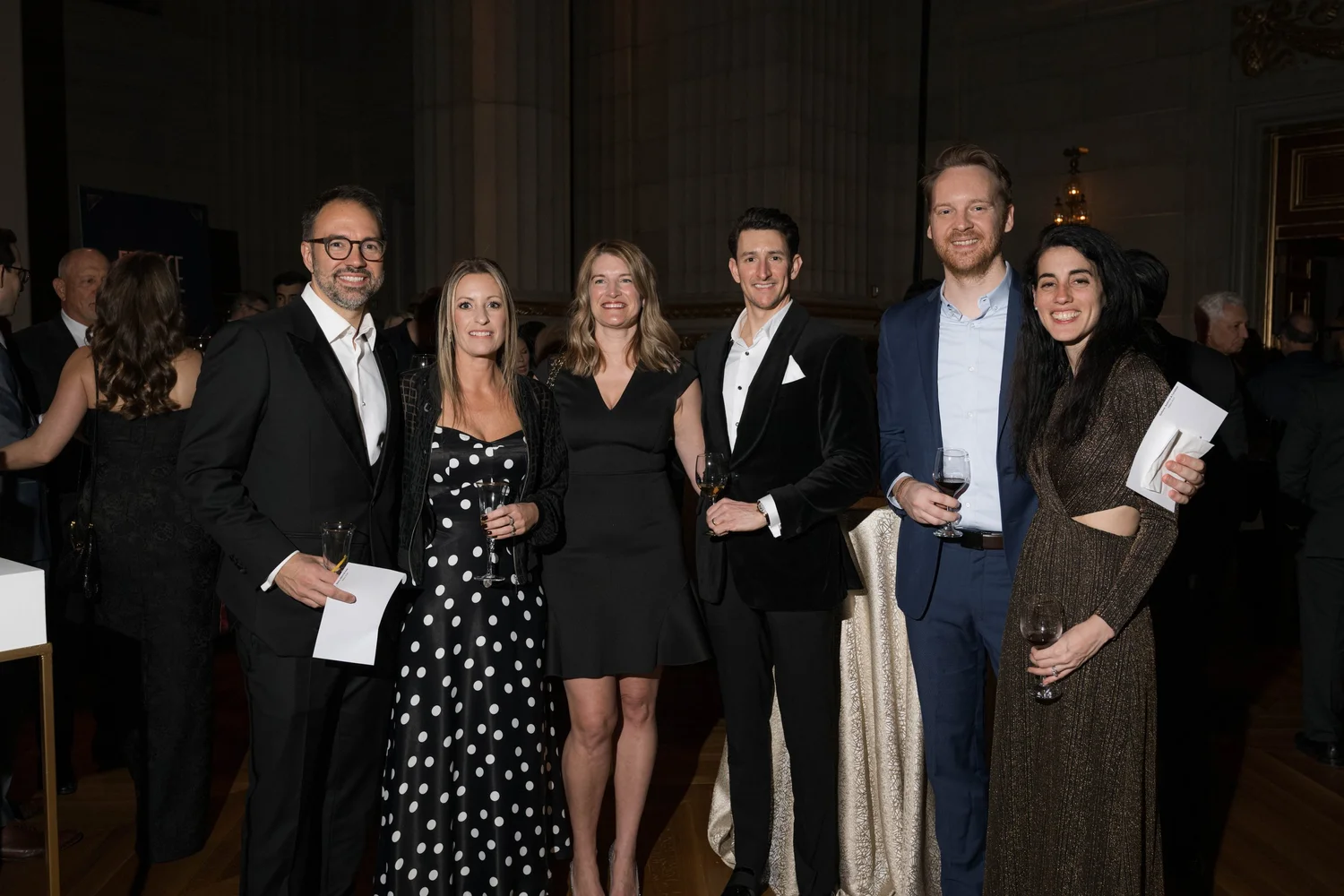 A group of A Vintage Affair 2025 event attendees smiling and posing for a photo.