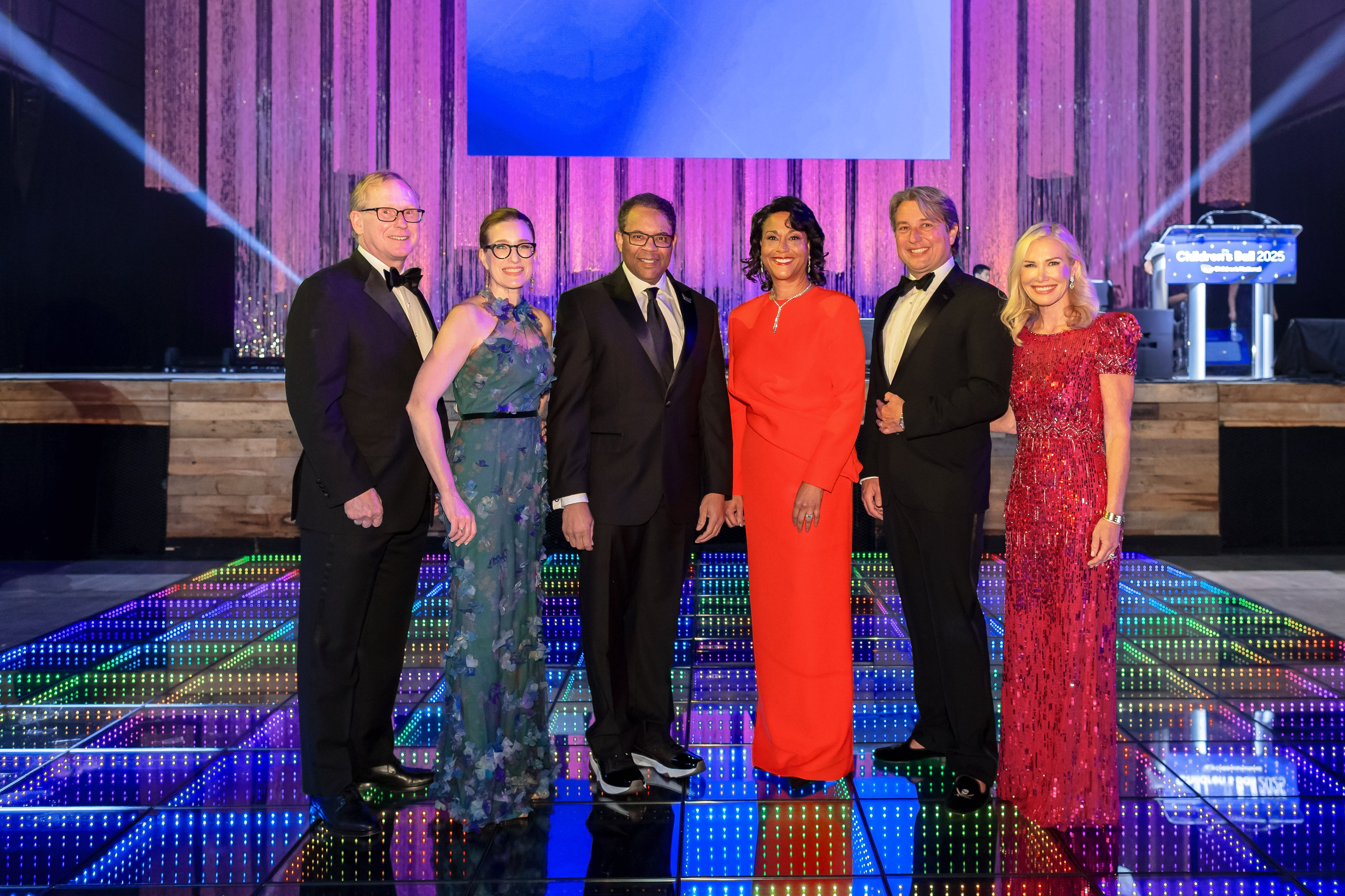 Event co-chairs, Jon and Allison Kling and Mara Glaser McCahan and Daniel McCahan, standing alongside Children's National President and CEO, Michelle Riley-Brown