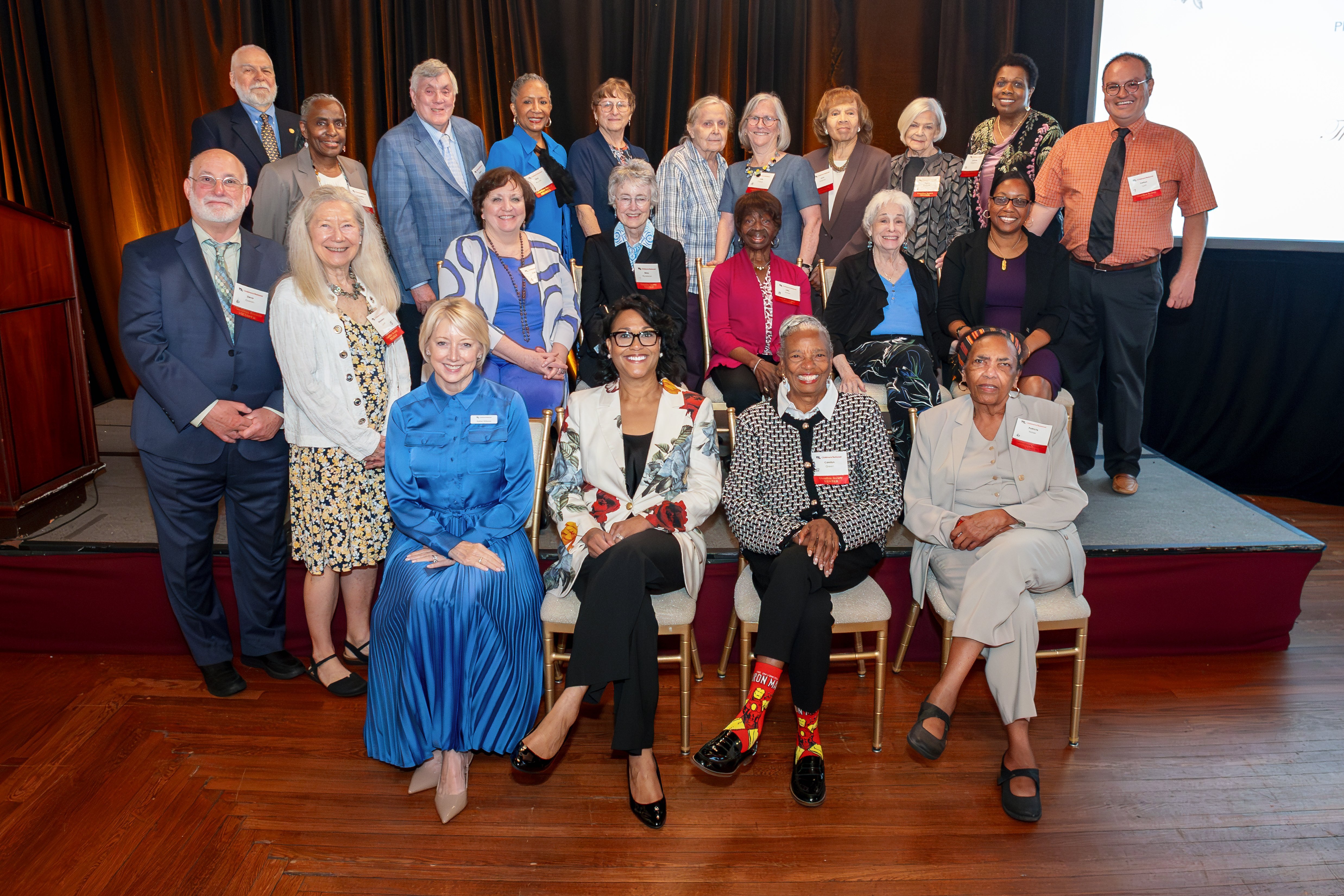 Guardian Society members pose for a group photo with Children's National President and CEO, Michelle Riley-Brown, at the 2026 luncheon.