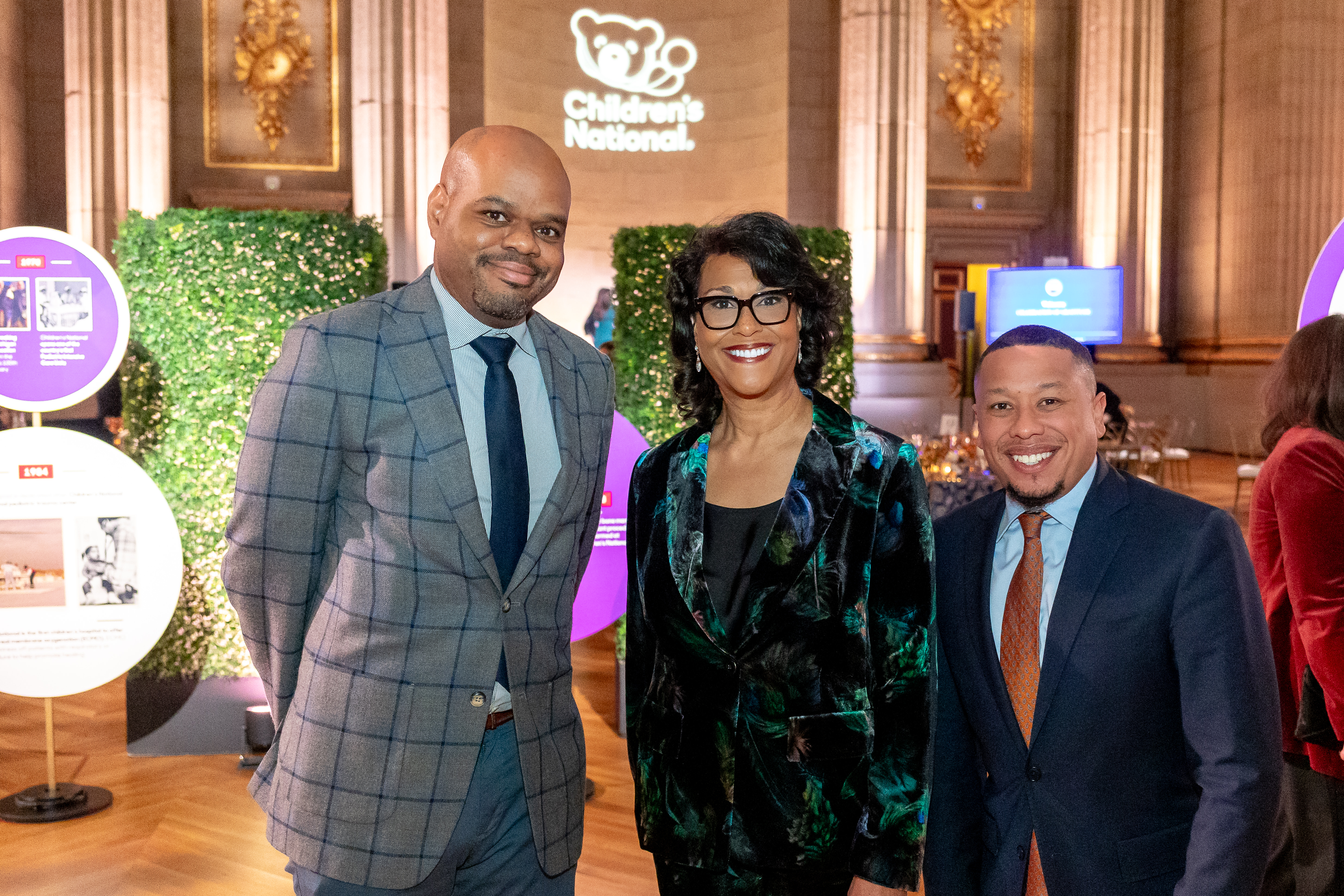 Michelle Riley-Brown, President and Chief Executive Officer of Children's National Hospital, poses with two attendees at the Trust Celebration of Gratitude event.