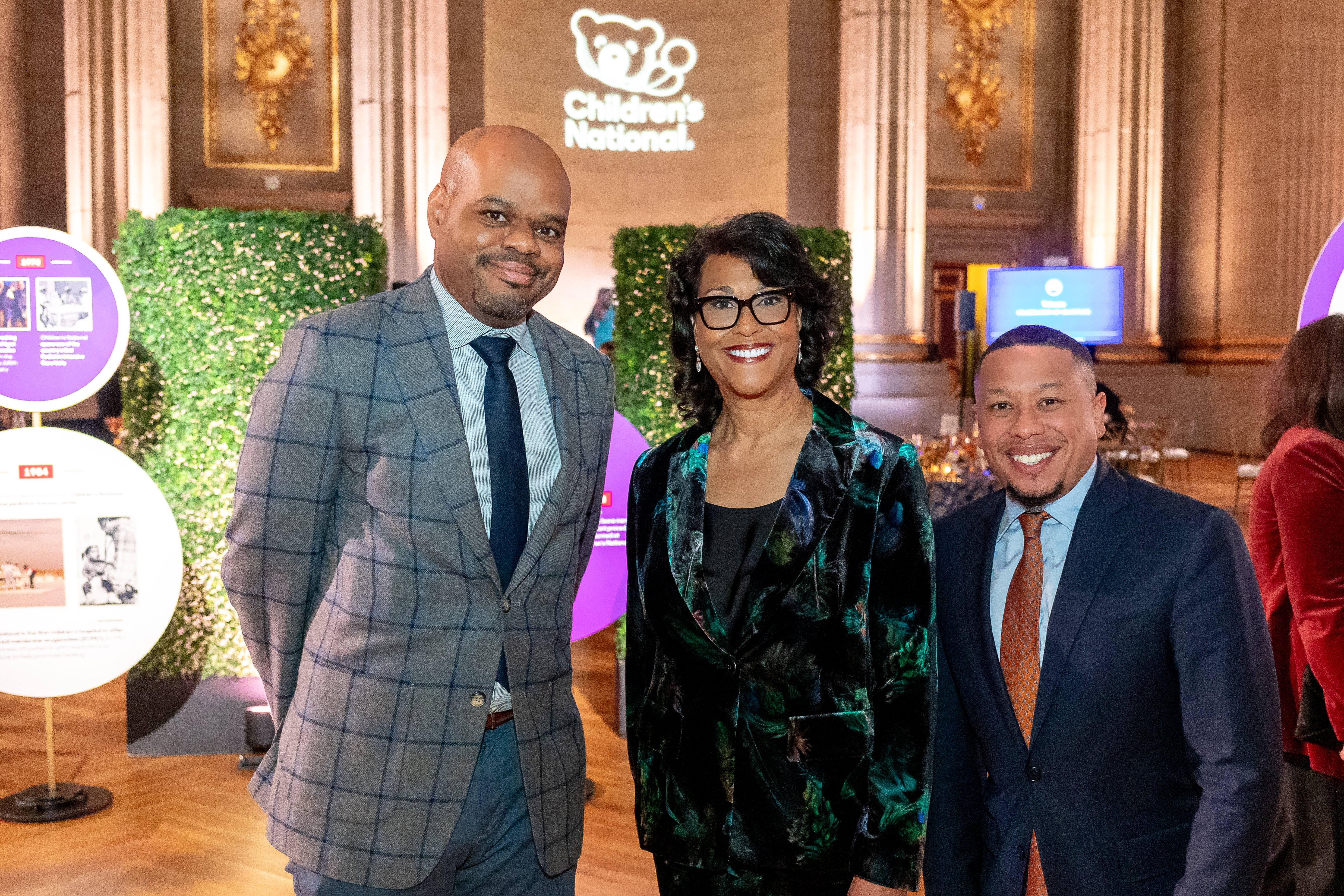 Michelle Riley-Brown, President and Chief Executive Officer of Children's National Hospital, poses with two attendees at the Trust Celebration of Gratitude event.