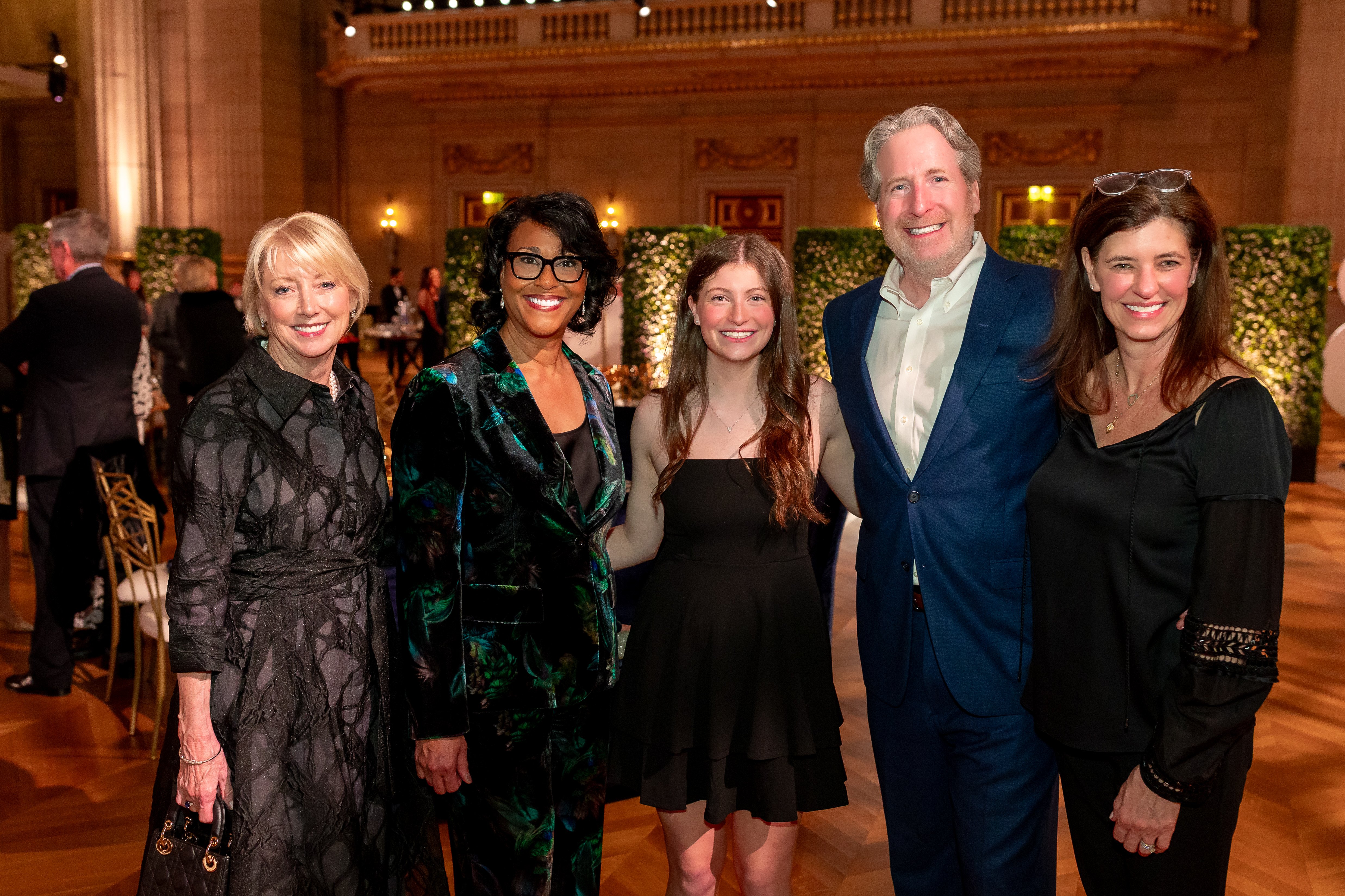 Michelle Riley-Brown, President and Chief Executive Officer of Children's National Hospital, poses with four attendees at the Trust Celebration of Gratitude event.