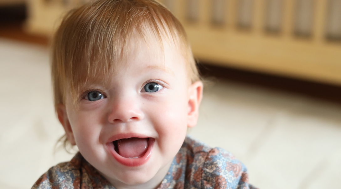 Baby smiling at camera