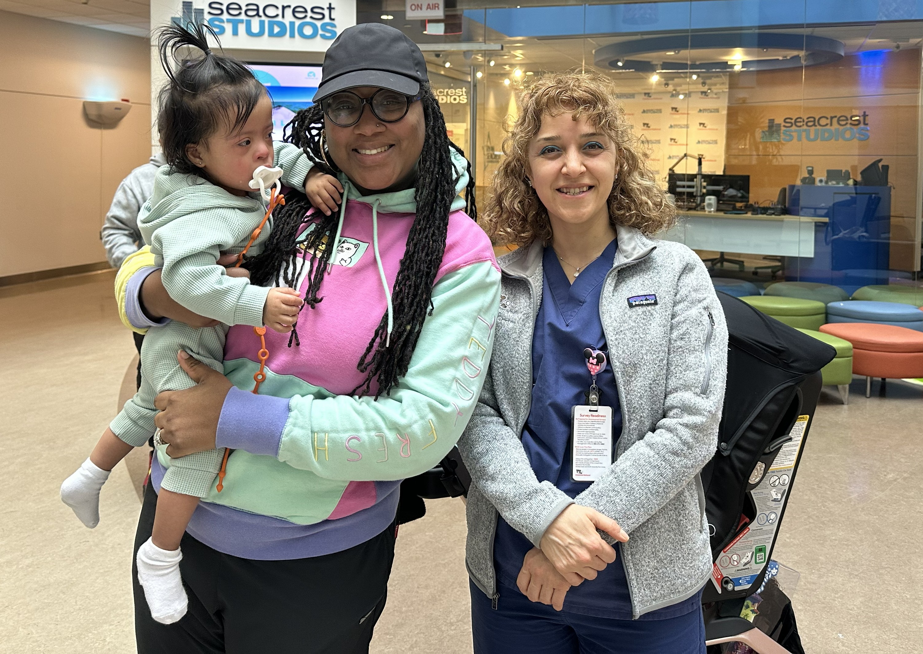 Raya and her family pose for a picture with Aybala Tongut, MD.