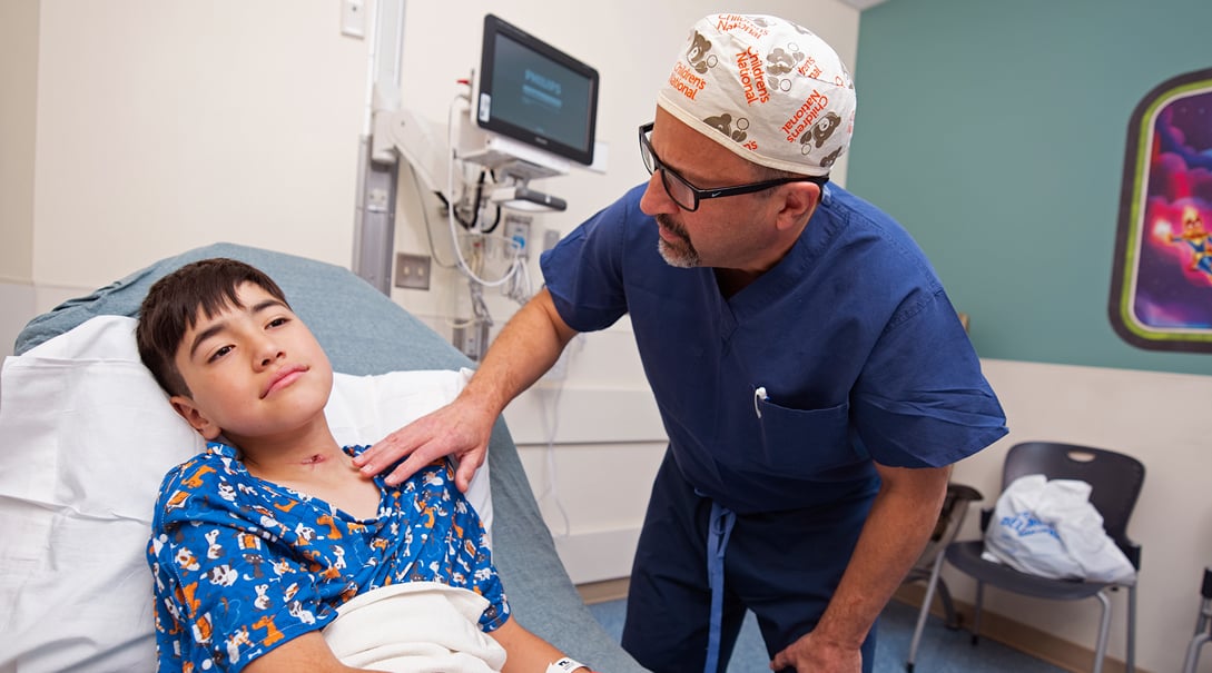 Doctor Diego Preciado, chief of Otolaryngology, examines patient Jorgé before a follow-up procedure.
