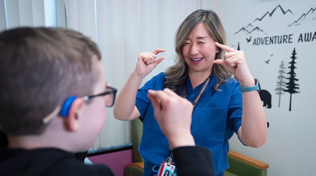 Doctor Jullie Rhee conducts a neurological exam with patient Liam.